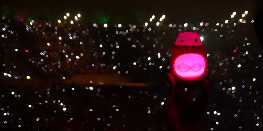 TukToro glows a warm red in a sea of shining flashlights